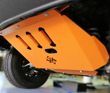 An orange underbody protection plate for a Sprinter van, designed to protect the vehicle's undercarriage components.